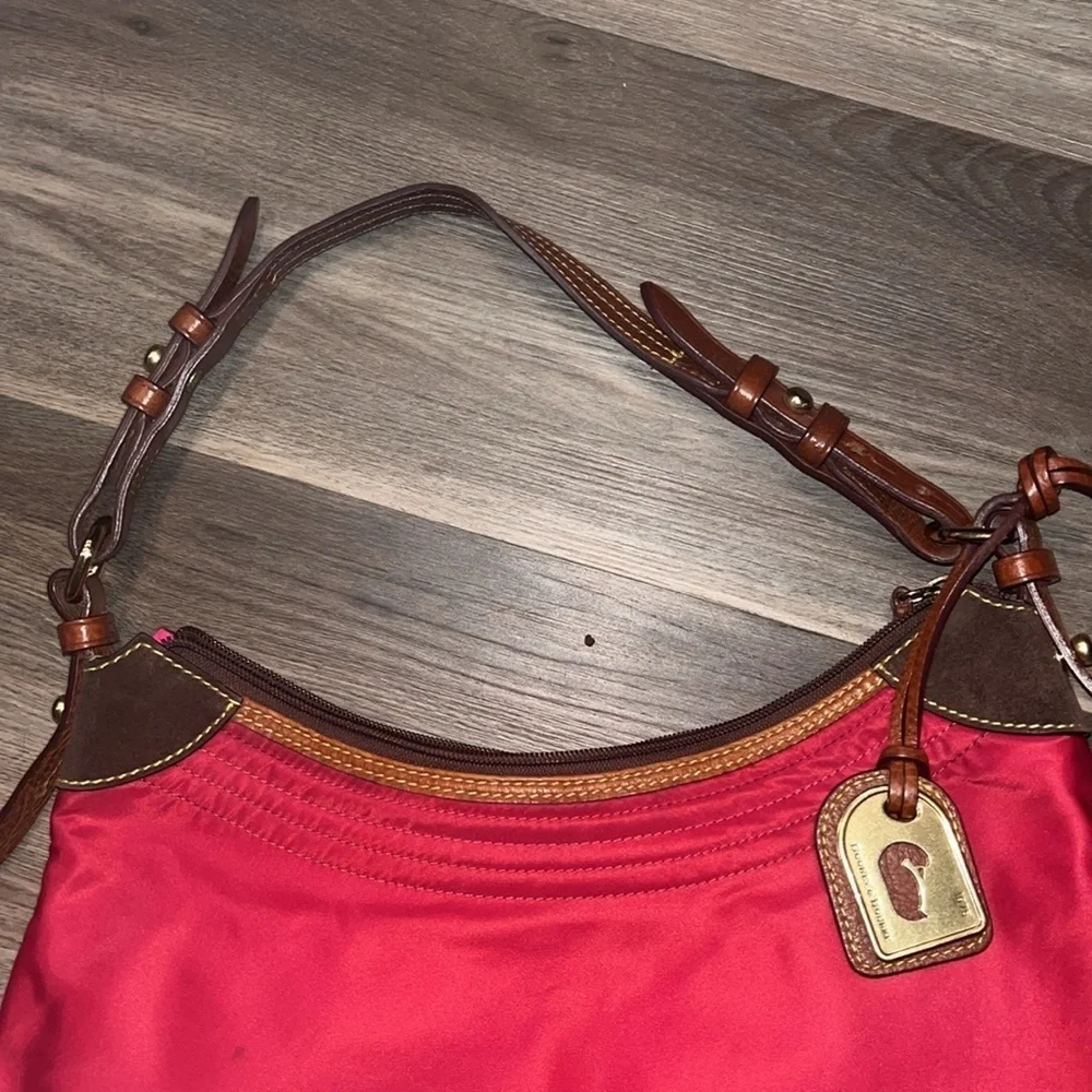 Dooney & Bourke boho sak purse in red with hot pink interior 1975 tag
